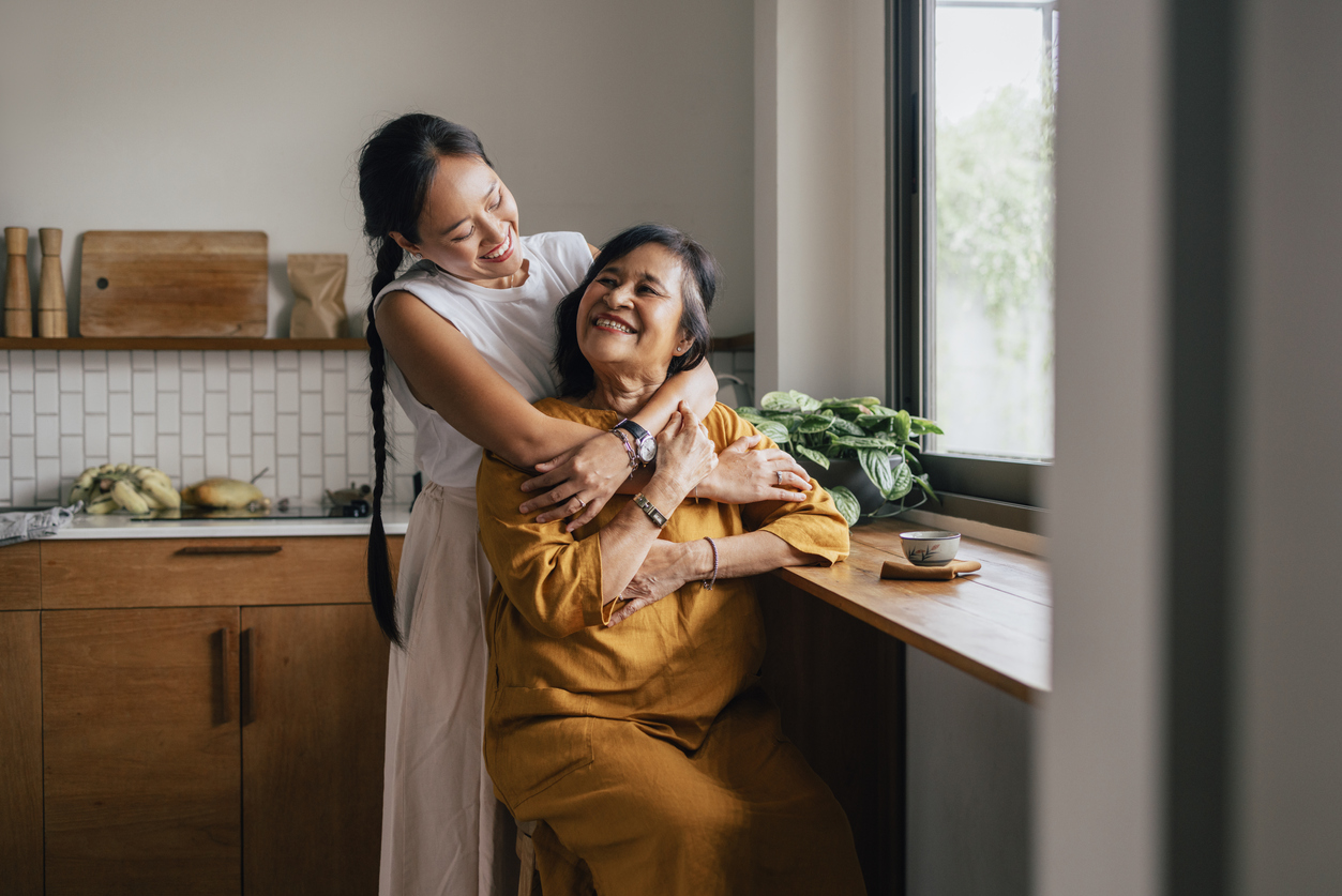 Elderly Woman caressed by woman.